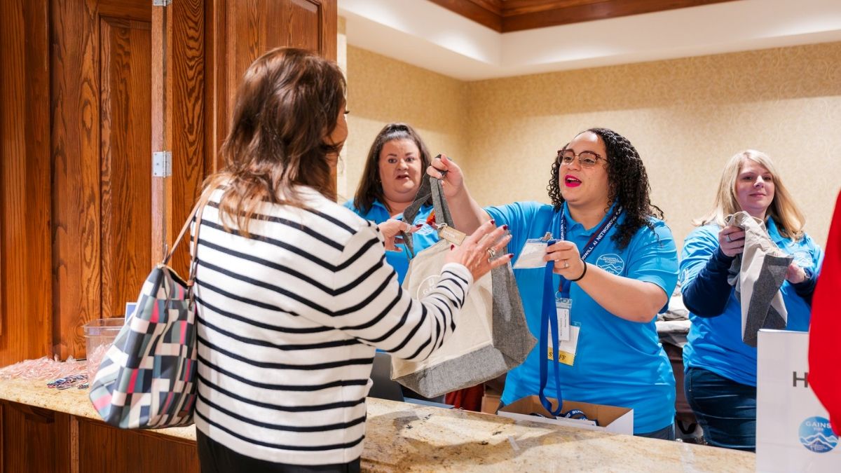 Candid attendee networking interactions during corporate reception