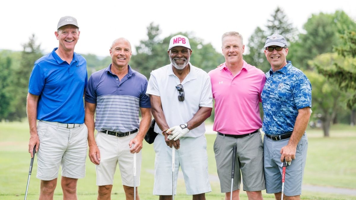 Celebrity golf tournament participant action at corporate outing