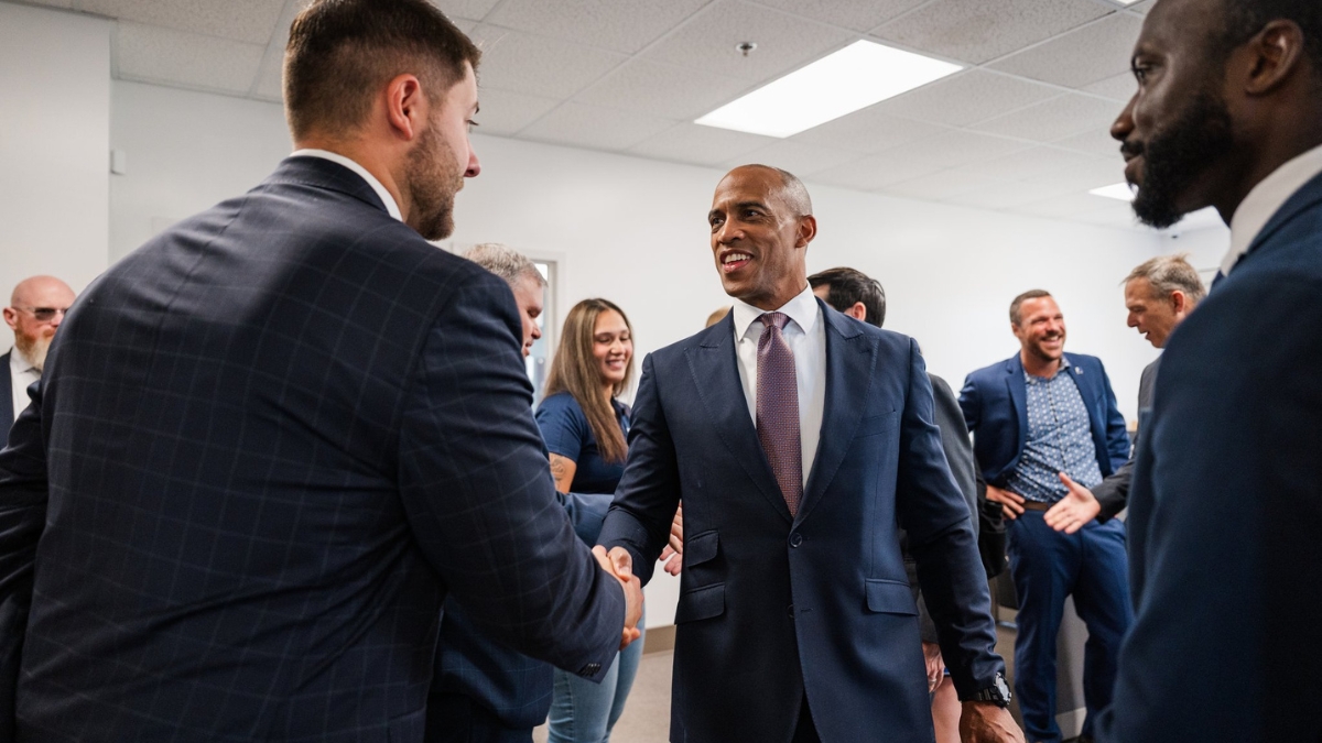 Pennsylvania Senator greeting attendee with handshake at official government function