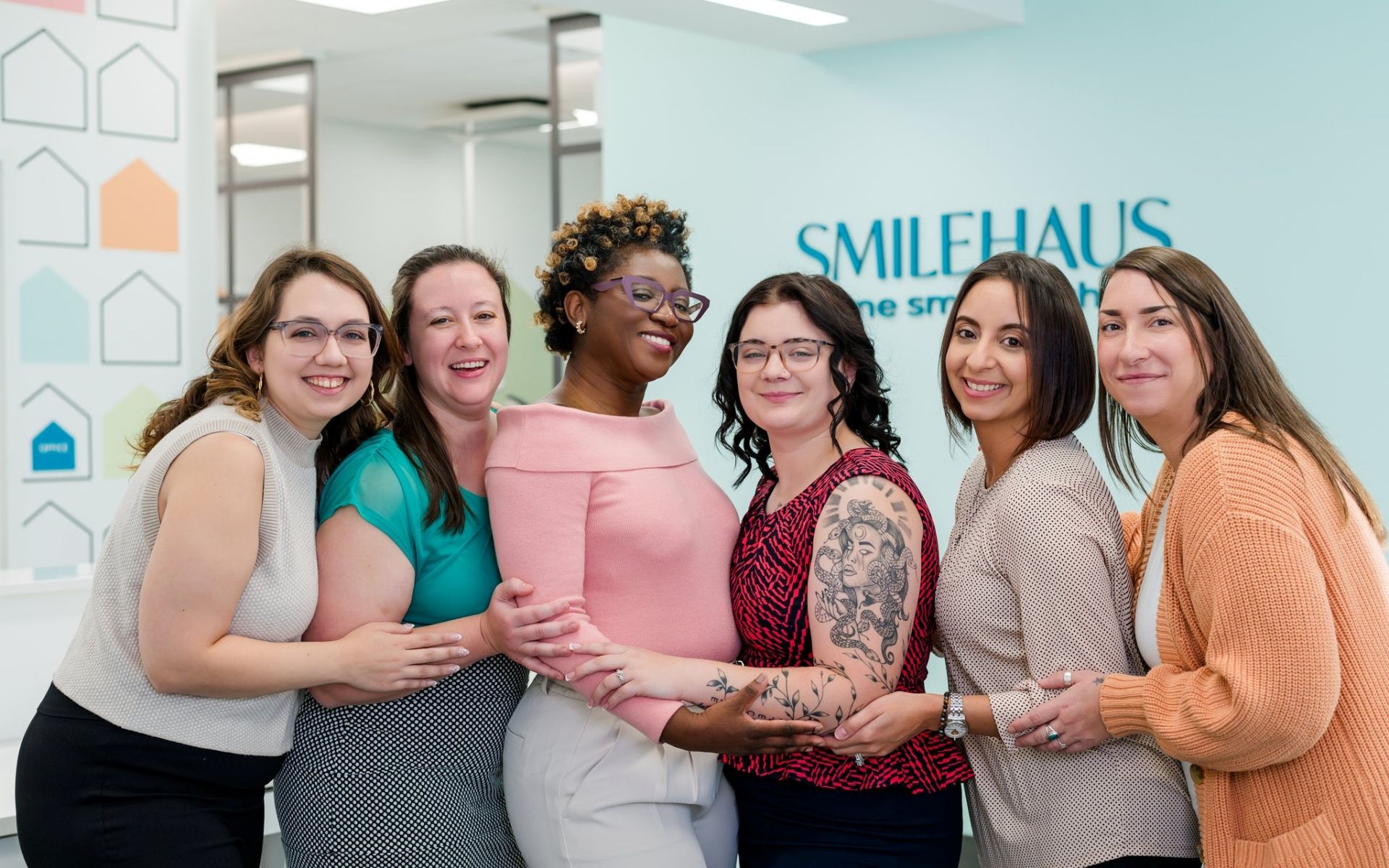 Smilehaus Pediatric Dentistry staff group team portrait with tailored studio lighting in Mechanicsburg PA